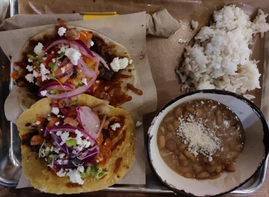Pictured above is the taco meal with a beef birria and spicy baja shrimp taco, with rice and beans.
