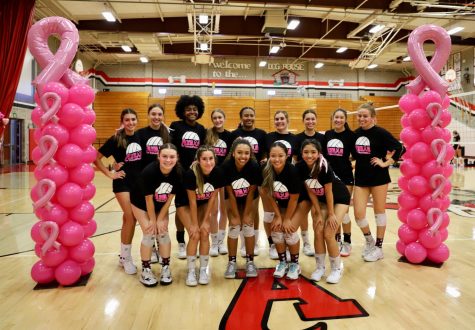 Varsity volleyball at their annual Pink Out game, where they later defeat the Bearcats 3-1. 