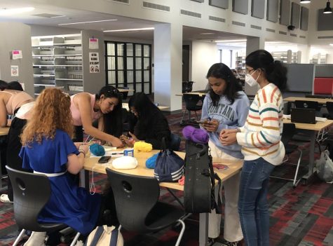 Crochet Club members receive instruction from club president Giselle Sanabria (10). Meetings are held every Wednesday and Friday after school in the library.