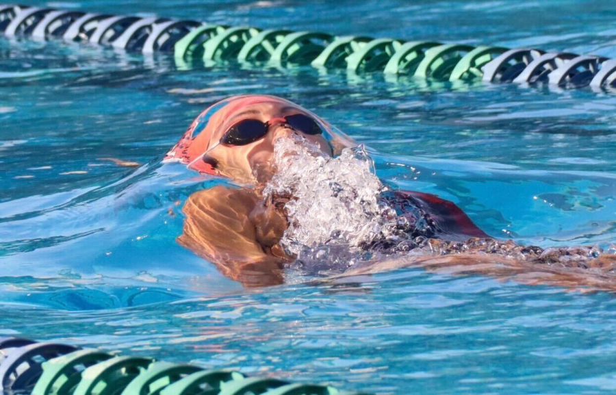 Victoria Villarreal (12), an UNLV committed athlete, competes in the 100 backstroke, one of her strongest races.