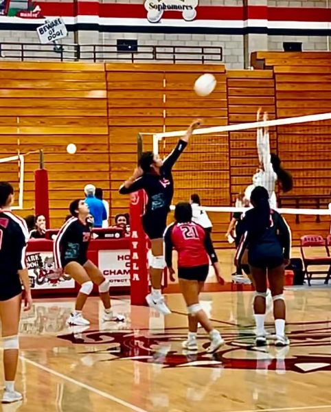 Ada Rivera (10) demonstrates the abilities of female athletes as she prepares to spike a ball. Rivera was motivated by the Womens Nebraska Volleyball Game to perform to the best of her abilities and was inspired by the attendance at the game.
