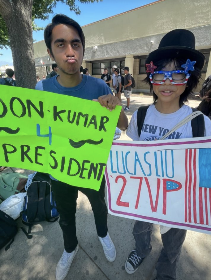 Freshman president and vice president contenders Don Kumar and Lucas Liu advertise their posters to promote their campaigns in the freshman officer election.