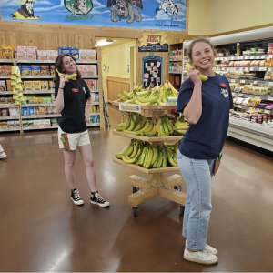 (From left) Crew members Emma Klose and Olivia Galindo showcase their playful personalities and happy attitudes while on their shifts. All employees show up to work with a smile on their faces, ready to serve their customers. “Trader Joe’s is my first job and I love it because of the great work environment,” Emma Klose said. 
