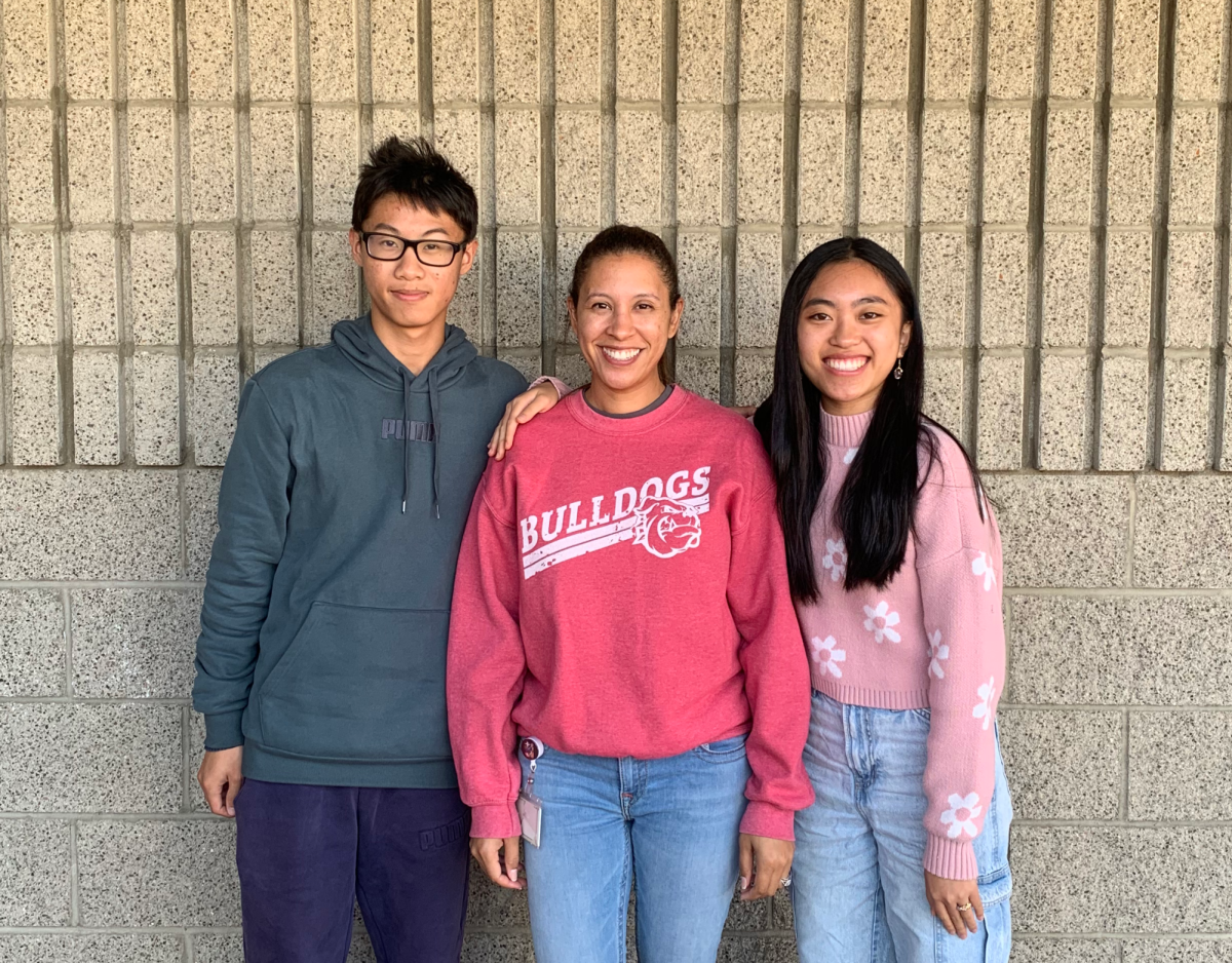 As students are being informed whether or not they received perfect scores on their 2023 AP exams, Ayala was able to have two students that received perfect scores on their AP Research exam. Lukas Cao and Ky-An Dinh, both students of Mrs. Barreras AP Research class, were able to receive full points in all categories of the AP Research rubric and thus earn a perfect score. 
Pictured (left to right): Lukas Cao (12), Mrs. Barreras, Ky-An Dinh (12)
