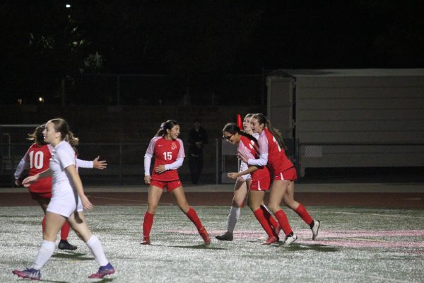 Moments after Sofia Torres (12, center) scored a goal to increase the lead to 4-2. Katie Trinh (11, left) and unidentified (right) celebrate with Torres in what ended up being a triumphant win in Round 1 of CIF play.
