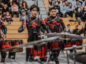 Percussion debuts their 2024 Indoor Show As Above, So Below at Chino High School last Saturday. Throughout the show, members not only play their instrument flawlessly, but also tell stories with expressions and movements. Pictured from left to right: Nathan Wong (12) Garrett Reynaga (12).