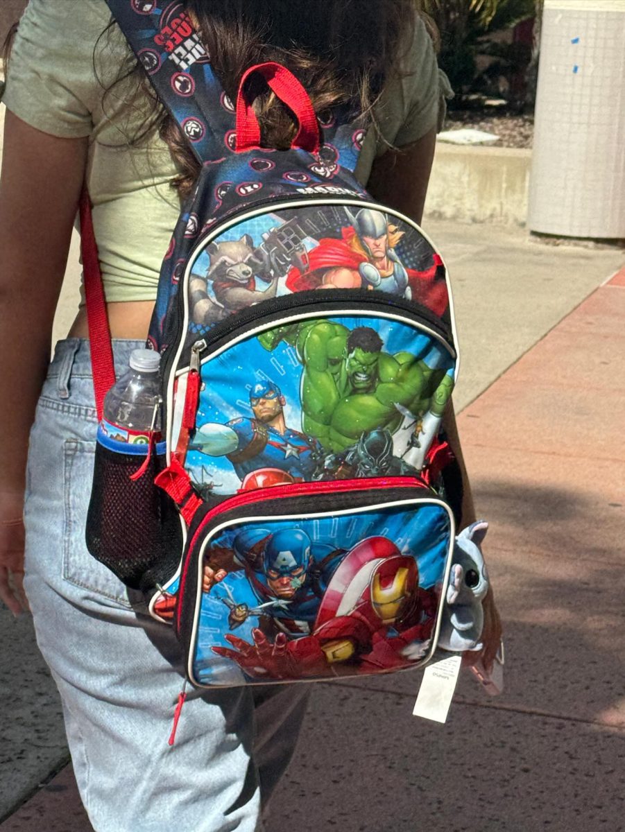 As a fun tradition, many seniors tend to use backpacks meant for little children. It commemorates their last year in high school, and is a nostalgic throwback to those carefree elementary days. Gianna Spagnolo (12) poses with her Marvel themed backpack.