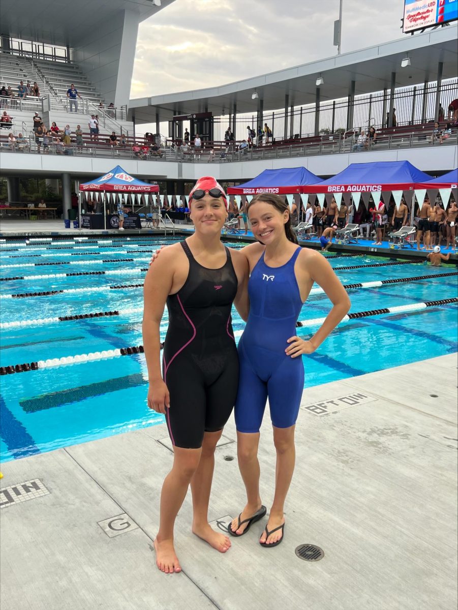After one of their many races at Mount SAC, Daniella (left) and Riley (right) Stabio pose in celebration of another successful win. With many years of experience in competitions like these, both sisters were able to swim for Varsity in the State CIFs as freshmen last year.