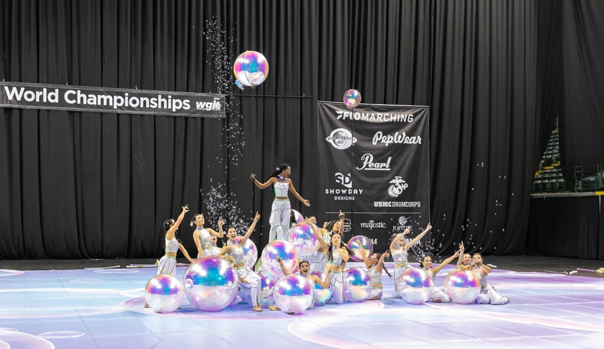 The Colorguard team (pictured above) finishes their last performance in Dayton, Ohio with bubbles floating around their bright set. This was the show that earned them the position in World Class, an accomplishment that had not been achieved since 2019.