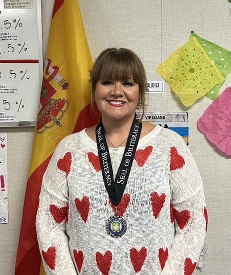 Ms. Reynolds proudly wearing the Seal of Biliteracy medal, which wasn't obtainable until she advocated for it. "Five years ago students did not have the Medal of Biliteracy and through some motivation of students, I selected two students that went and talked to the board," Reynolds said. 
"We were able to have our district give the Medals of Biliteracy to all students now."