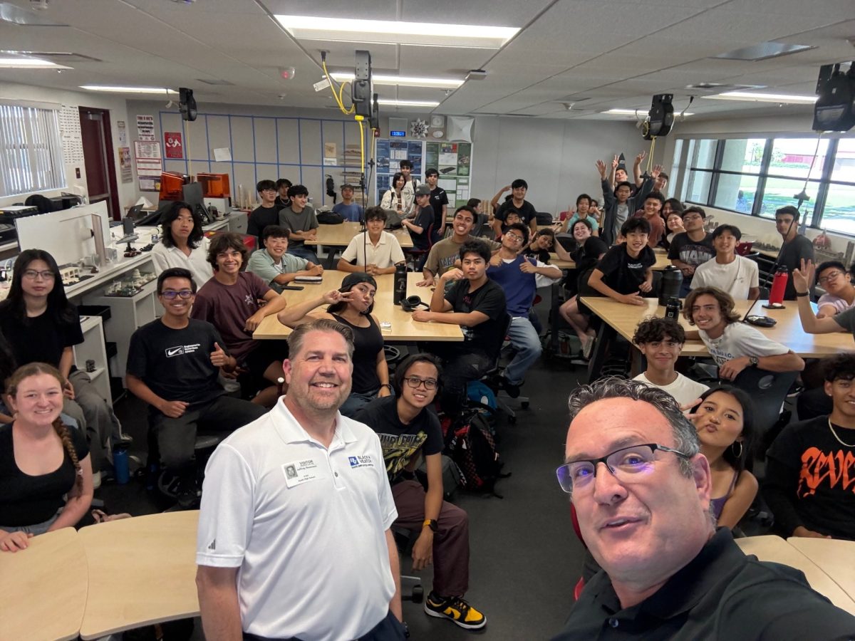 Students in Mr. Collins' classroom take a selfie before the lecture. Dr. Neemann was able to talk about what the end result is of the engineering pathway after college. "It actually shows the final step, or the end result of someone going through all the engineering classes," Adrian Espinoza (11) said. "Normally Mr. Collins would show how they just reached college, or like their end of college experience, but with Dr. Neemann, we're actually able to see the effect and like of what someone does in engineering."