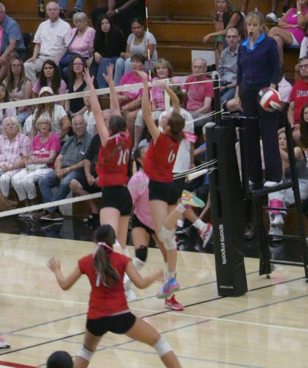 Freshman Ella Galindo (#10) and Junior Ella Kroeze (#6) go up to block Glendora's Outside Hitter as Senior Captain Abigail Dominguez (#15) covers her blockers from below.