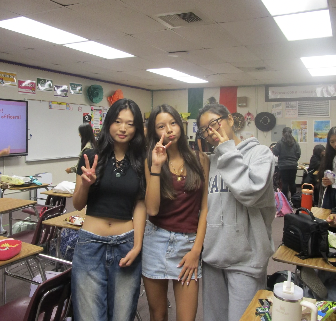 From left, Grace Kim (9), Zoey Lepo (9), and Joann Park (9), members of Korean Culture Club, celebrate their Korean heritage. Hoping to find a community of people who share common customs, the girls eagerly wait for the club's first meeting. 