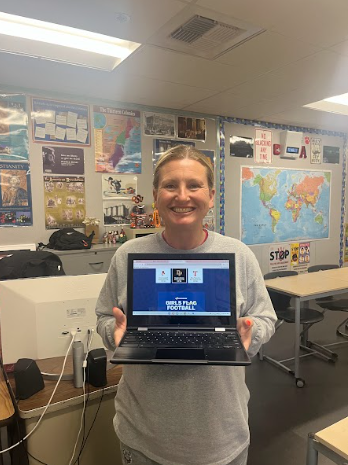 Flag Football Coach Ms. Amy Campbell shows off that she got nominated as the LA Rams Girls' Flag Football Coach of the Year with the help of votes from enthusiastic supporters. 