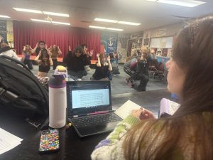 Assistant director, Karly Welsh (12),  watching auditioners practice before their official examination in groups.