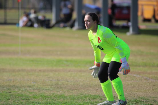 London McCue anticipating the ball heading into her territory. Throughout the season, McCue has helped to keep the team's spirit up and together.