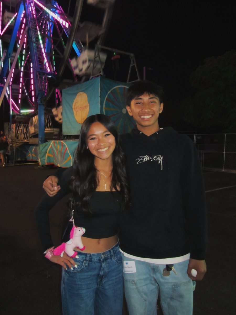 Chloe Dy (10) and Corvin Danan (11) enjoy a night at the fair.