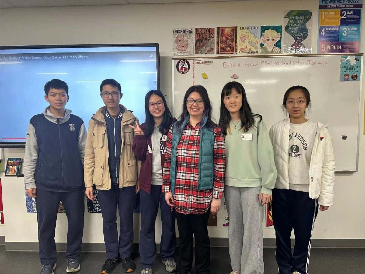 International students taking a group picture with Ms. Eileen Tse, the journalism advisor, as they conclude their stay at Ayala high school. 