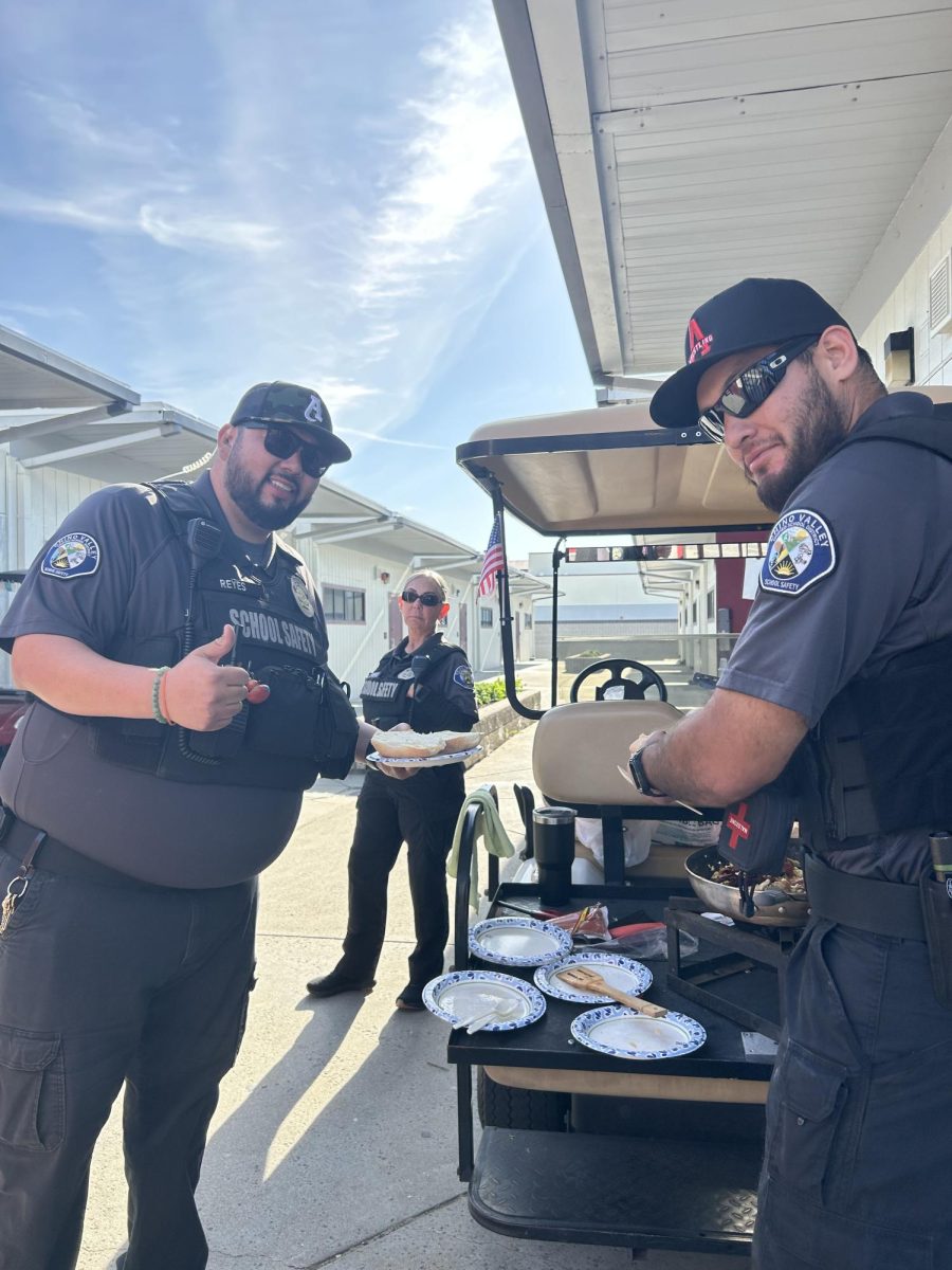 Security officers enjoy their monthly tradition of cooking breakfast together in the H portables which has fostered friendships between each of them.