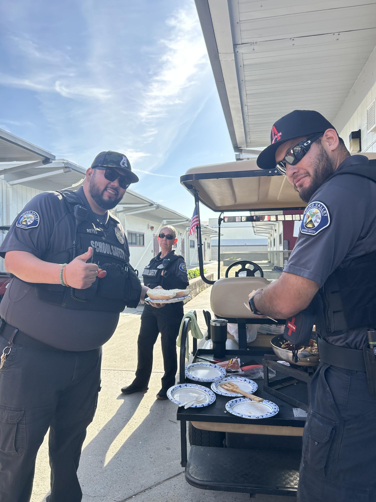 Security officers (from left to right: Jonathan Reyes, Barbara Cardenas, Santiago Sotelo) enjoy their monthly tradition of cooking breakfast together in the H portables which has fostered friendships between each of them.