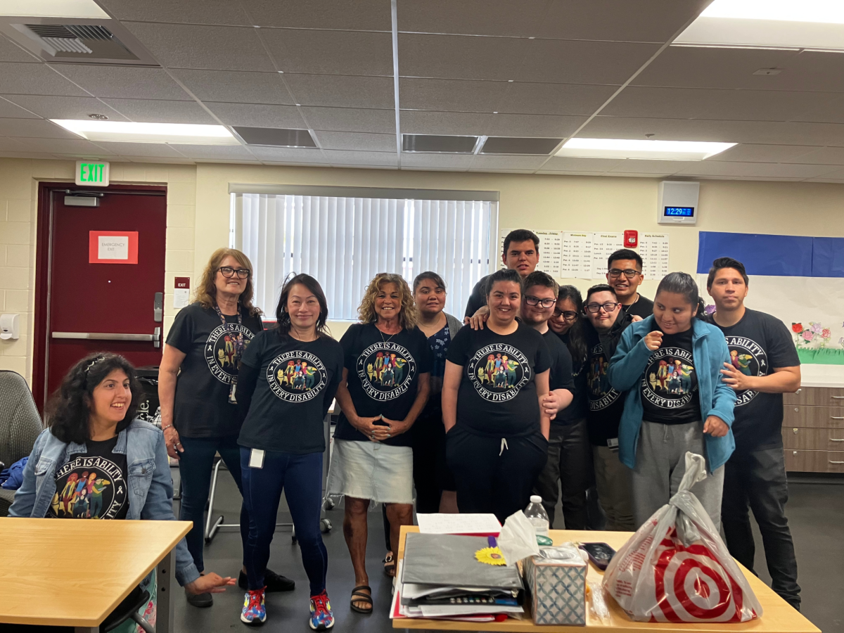 Yi Eubanks and her students wearing Autism Awareness shirts to show their support.