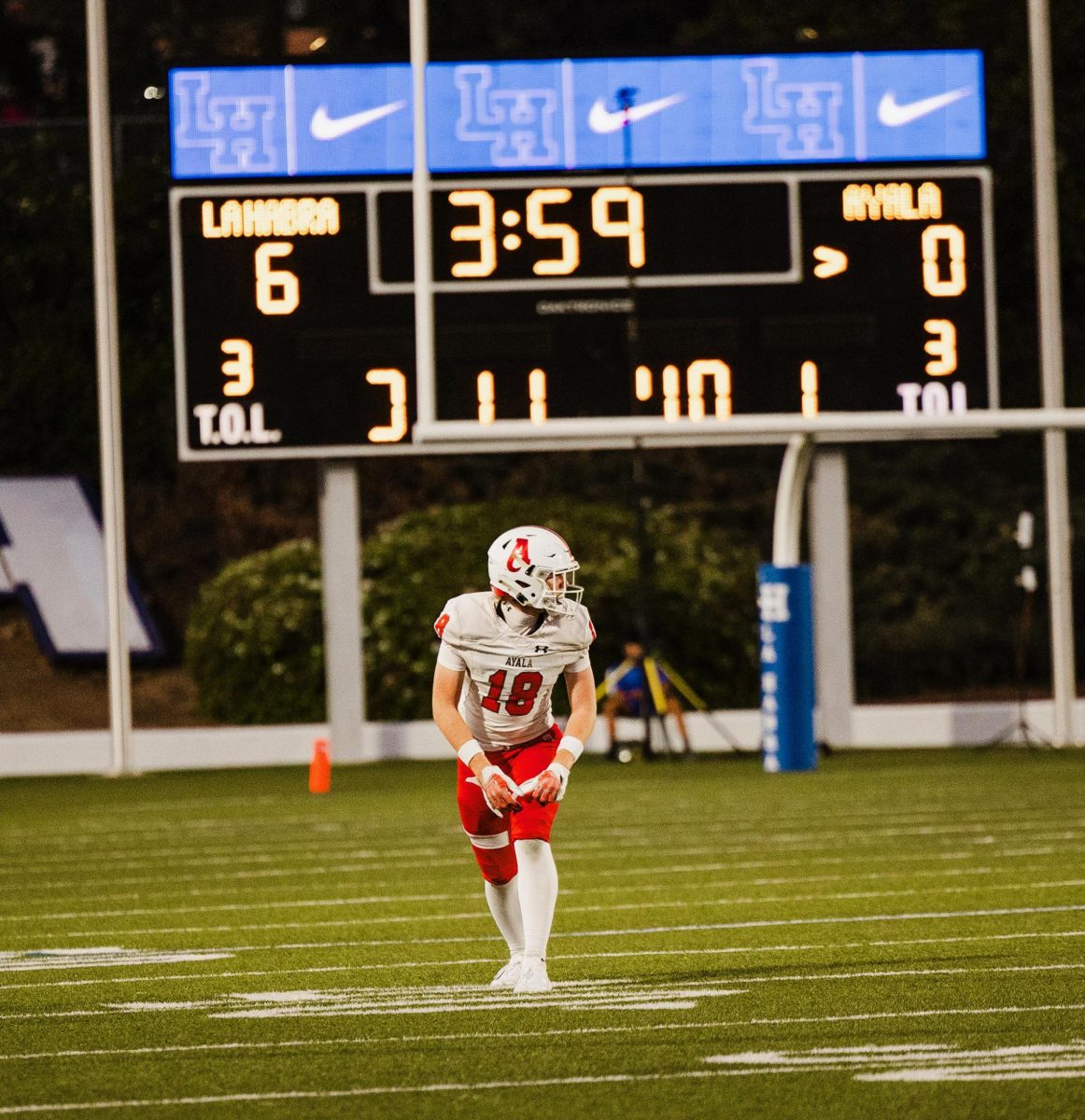 Blake Frausto (12) lined up on offense for the Bulldogs when they played the La Habra Highlanders during the previous season on September 6.