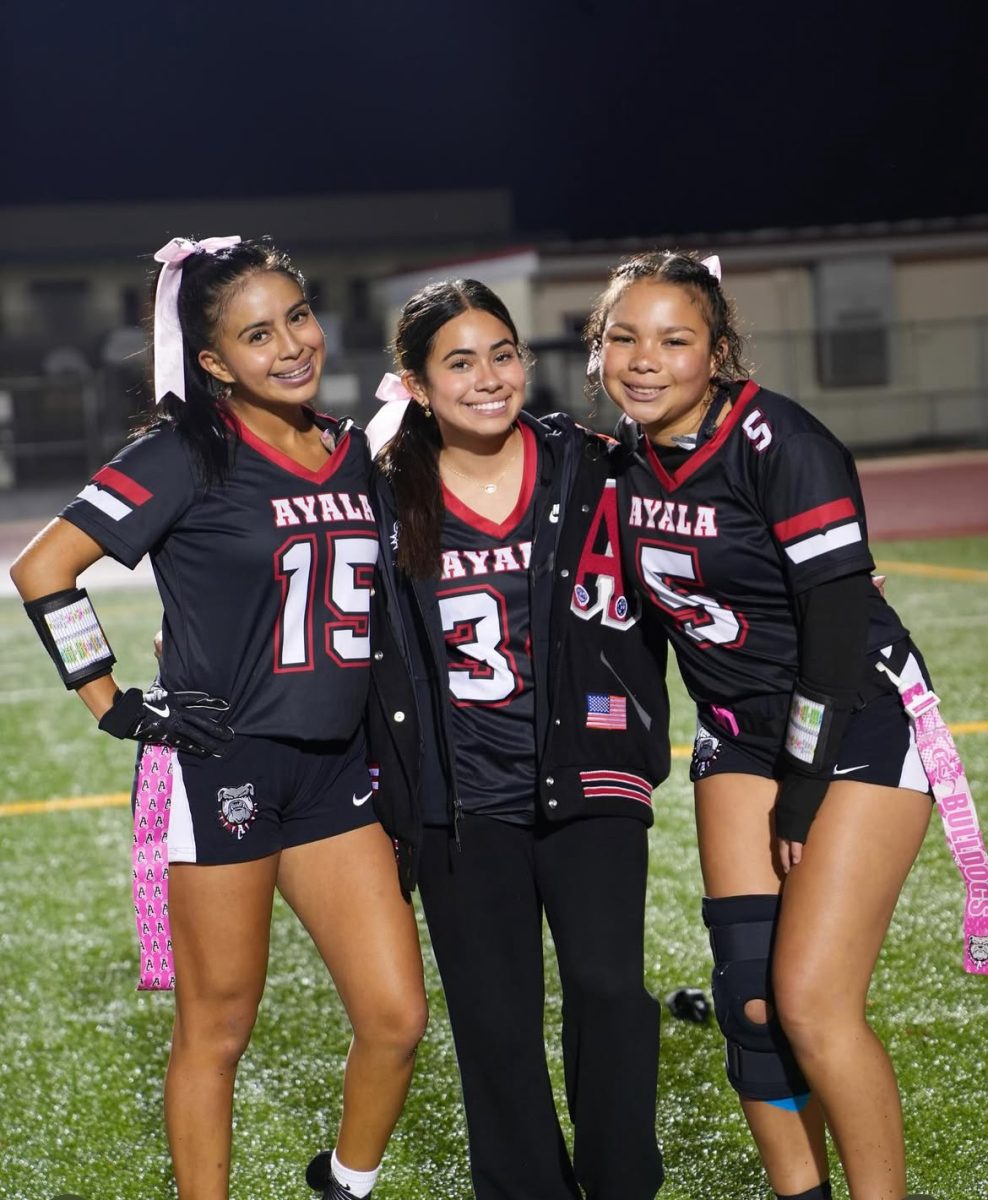 Seniors Audrey Raglin, Nevaeh Lima, and Sophia Ordorica pose for a picture on Senior Night before their game against the Tartans.