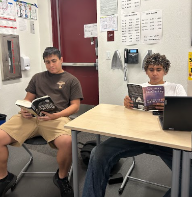 Senior students Christian Garcia (12) and Matthew Gardea (12) silently reading during class to support the Readathon