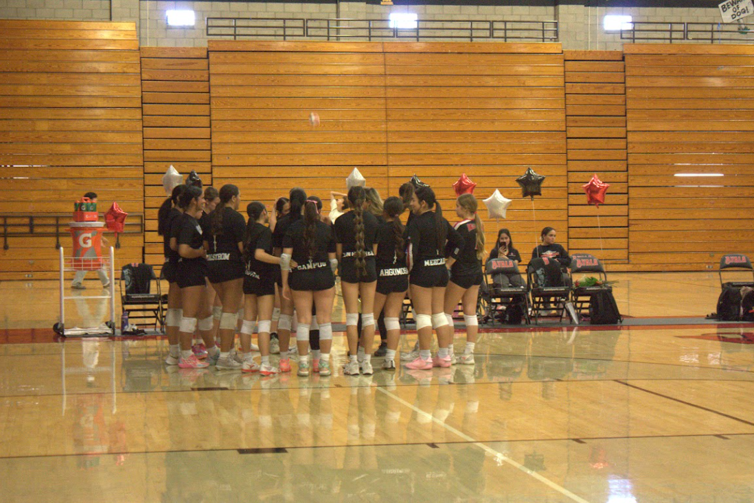 Bulldogs prepare in their huddle for the last game of their season, ending the 2025 season with one last win on their memorable Senior Night.