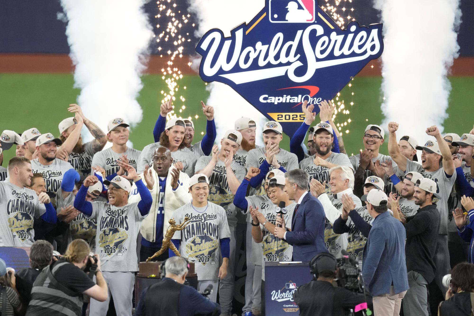 The Los Angeles Dodgers celebrate on the podium after defeating the Toronto Blue Jays in game seven of the 2025 MLB World Series at Rogers Centre.