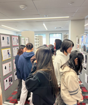 AP Studio Art students peacefully observe the beautifully curated pieces by both their peers and their own pieces as well. This experience gives students a chance to be immersed in the wonderful world of art. 