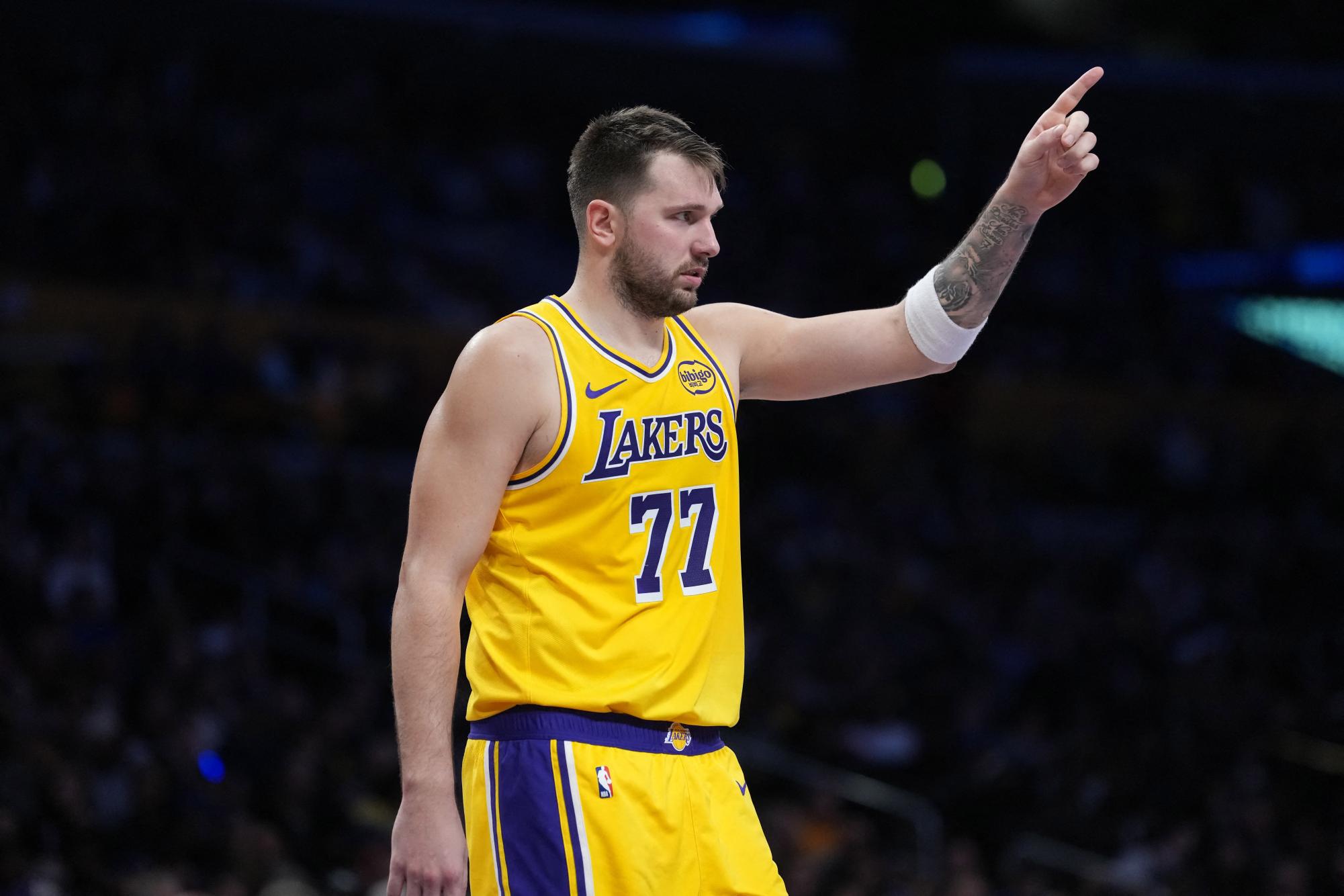 Los Angeles Lakers guard Luka Doncic (77) gestures against the Charlotte Hornets in the second half at Crypto.com Arena. Last year, he was traded, which sparks the question of how he is doing today.