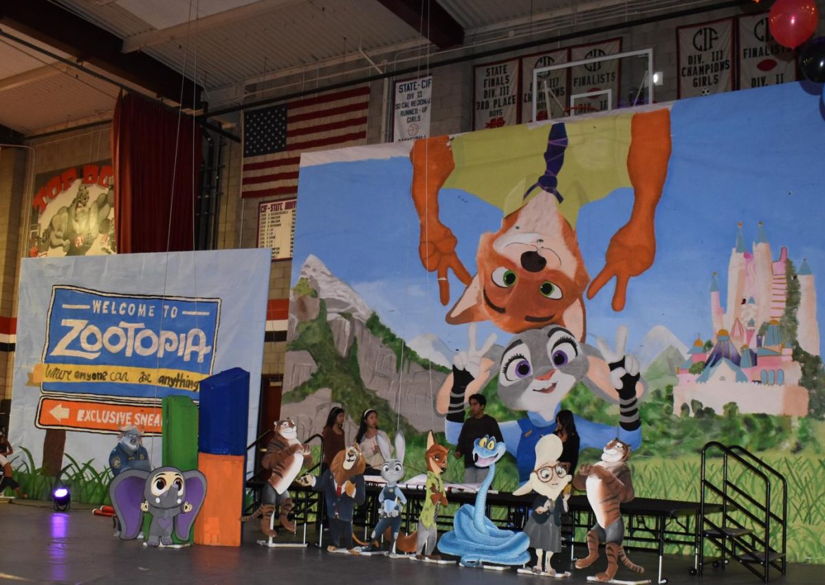 Judy Hopps and Nick Wilde greeted students in the gym as the curtains were pulled back to reveal the centerpiece of decorations.