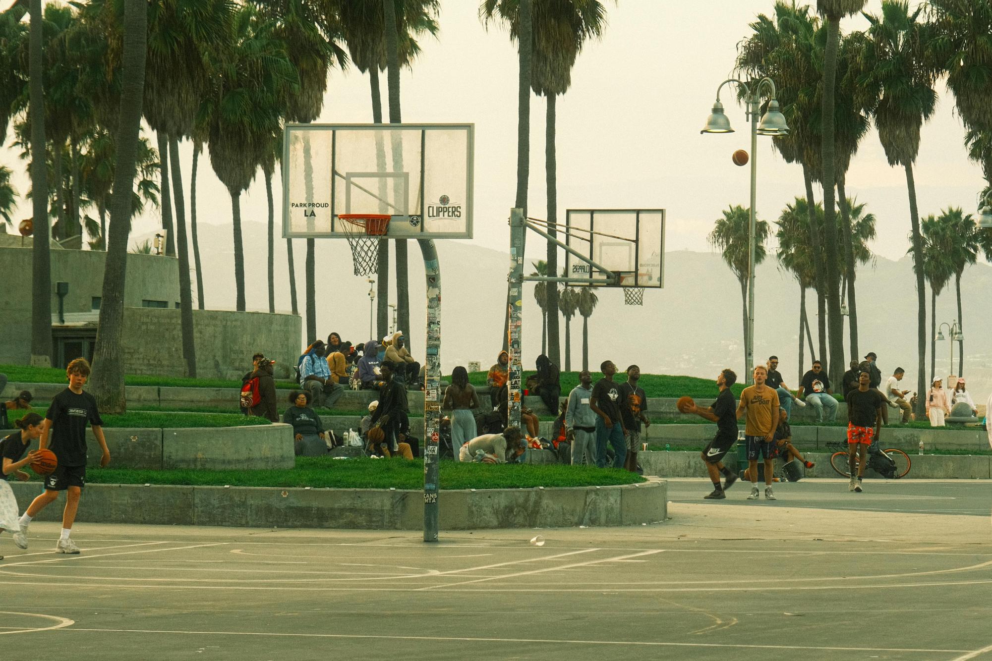 The public courts of Venice Beach are often packed with people playing pickup basketball.