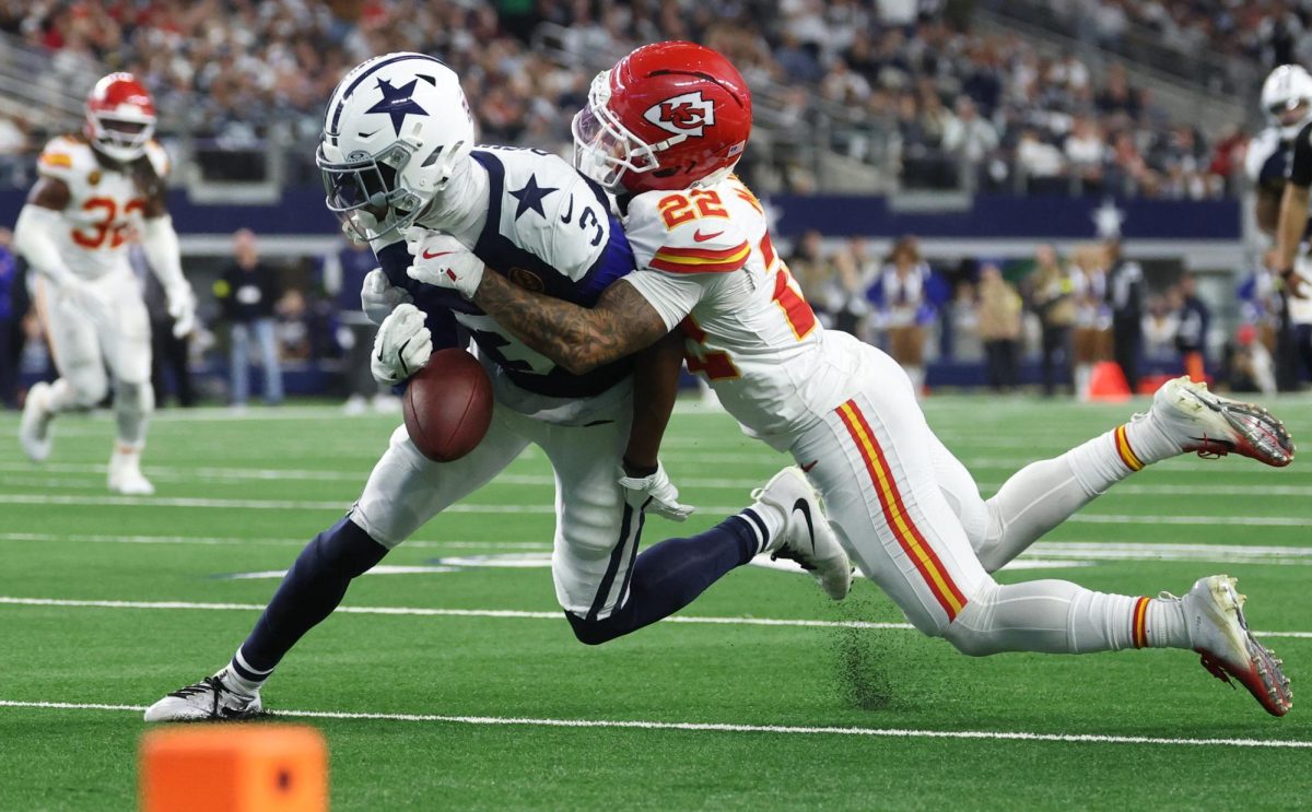 Kansas City Chiefs cornerback Trent McDuffie (22) forces a fumble from Dallas Cowboys wide receiver George Pickens (3) during the fourth quarter at AT&T Stadium.