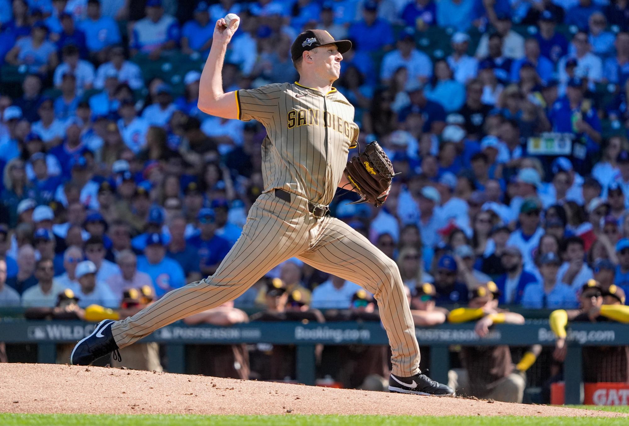 San Diego Padres starting pitcher Nick Pivetta (27) delivers a pitch against the Chicago Cubs in the first inning during game one of the Wildcard round for the 2025 MLB playoffs at Wrigley Field. 
