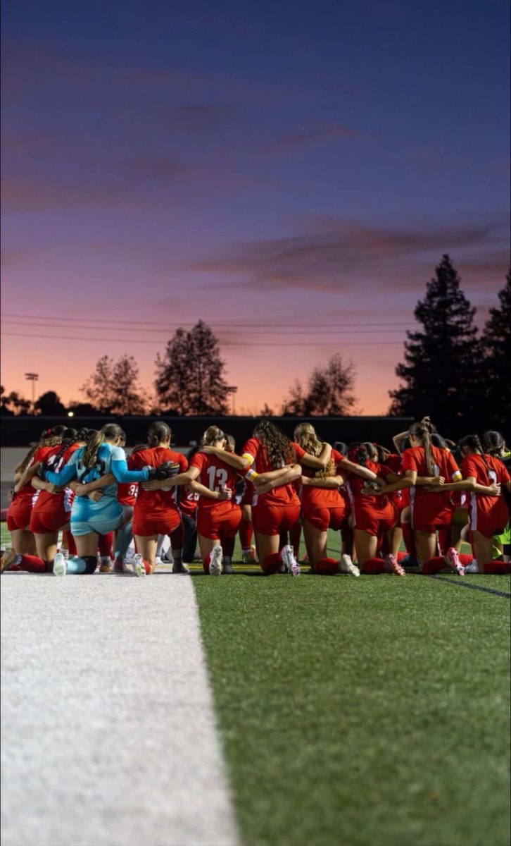 Ayala Girls soccer prepares together prior to a match