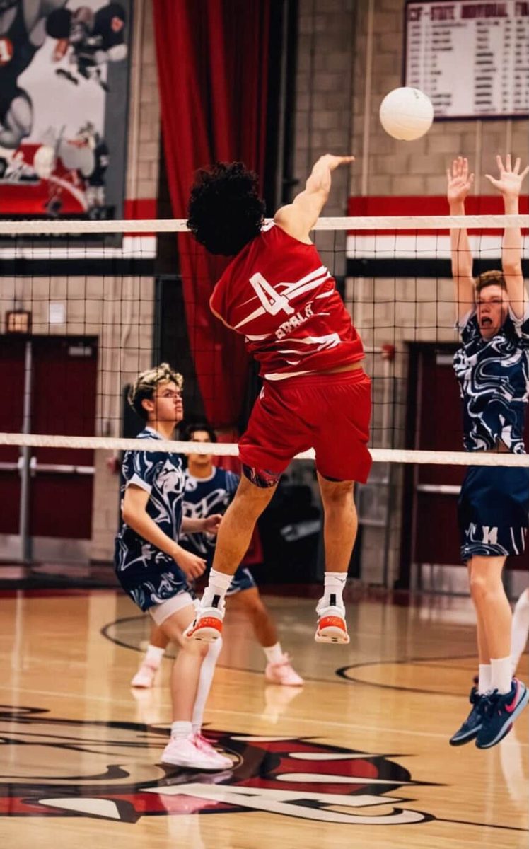 Aiden Coronel (12) spiking the ball against opponents. Coronel plans to Rome City Institute, where he will continue his volleyball career.