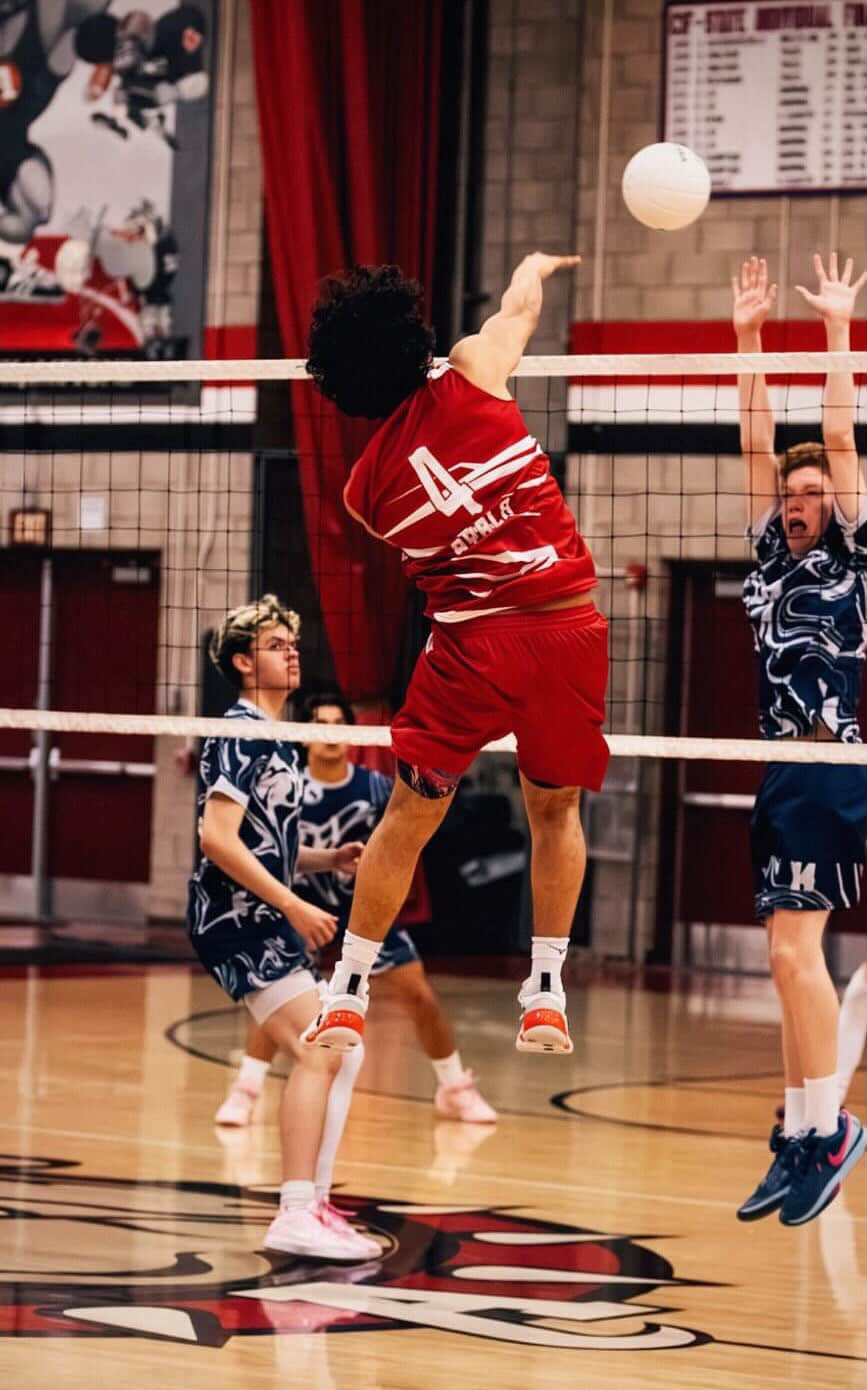 Aiden Coronel (12) spiking the ball against opponents. Coronel plans to Rome City Institute, where he will continue his volleyball career.