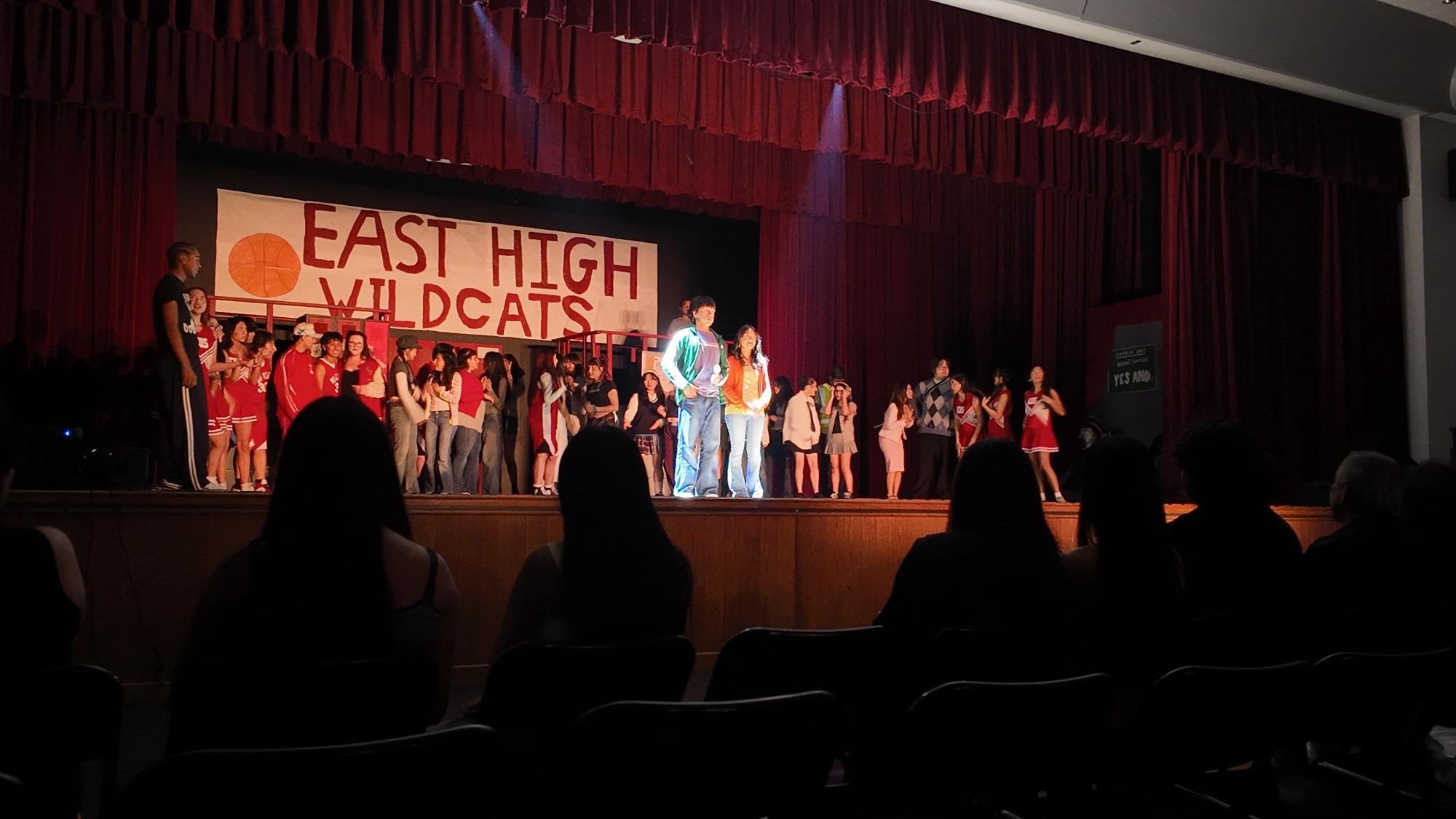 Soaking in the spotlight is Josiah Marchen (12) and Kayla Huizar (12), the actors of Troy Bolton and Gabriella Montez. Behind them is the energetic ensemble full of talented students.
