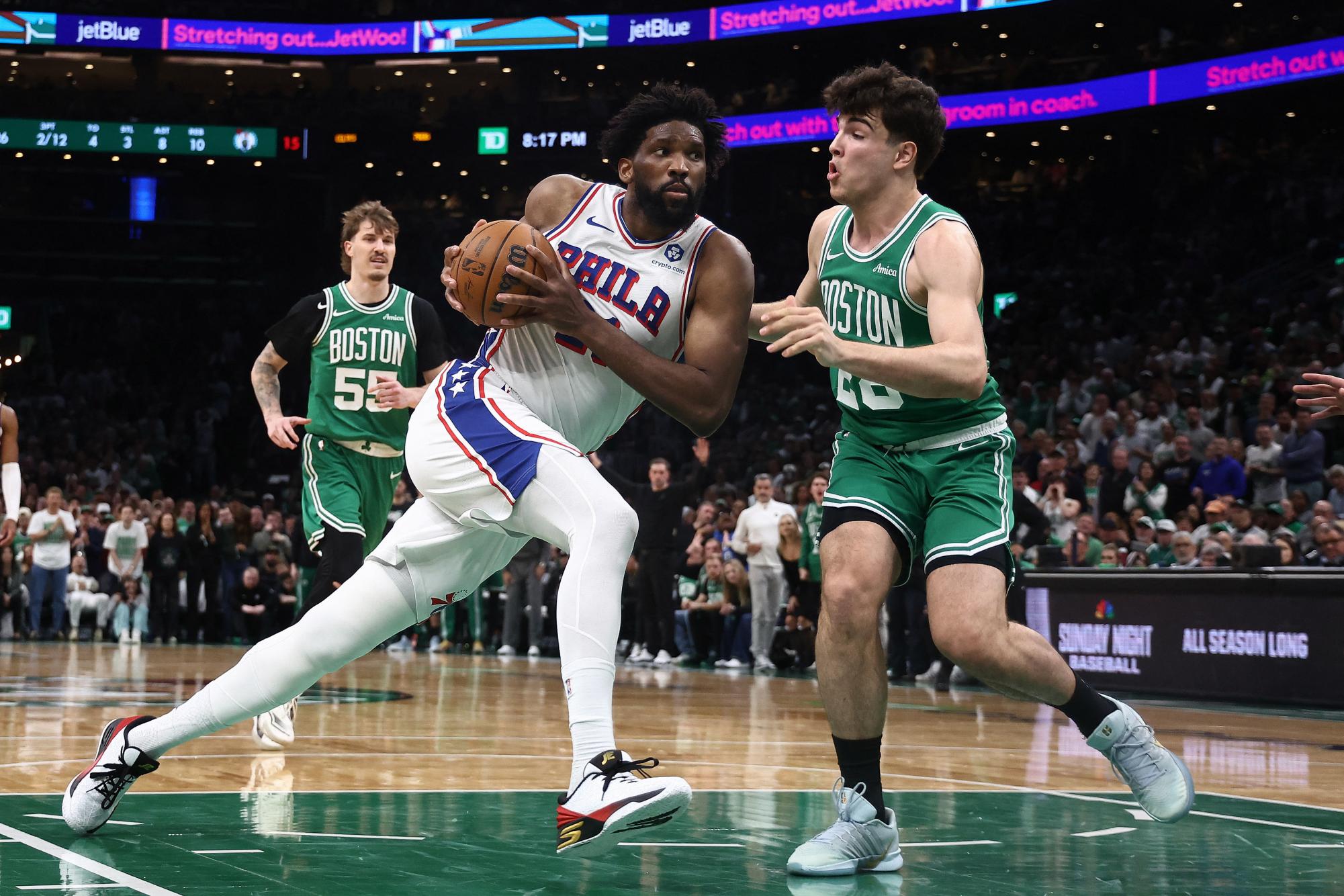 Philadelphia 76ers center Joel Embiid (21) drives on Boston Celtics guard Hugo Gonzalez (28) during the second quarter of game seven of the first round of the 2026 NBA Playoffs at TD Garden.